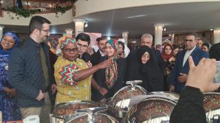 Madam Ambassador Kupemba Emphasizing a point to the Guest of Honor Madam Pary Sadat Araghchi [Lavasani] at the 15th Annual Charity Bazaar held in Tehran