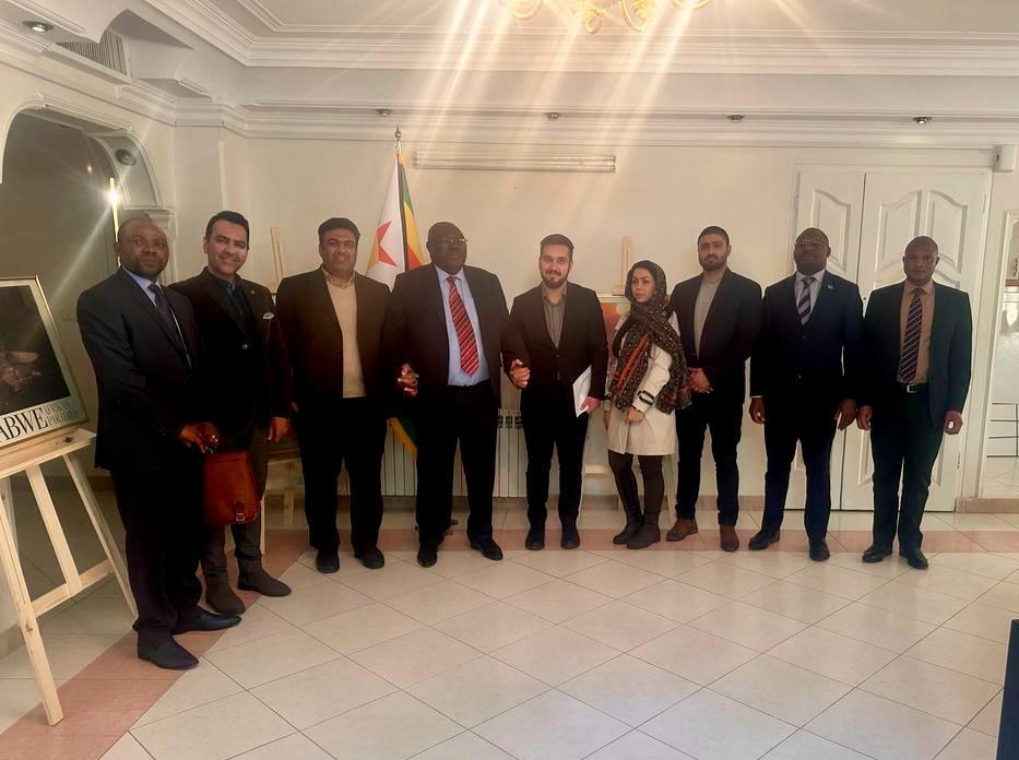 After a fruit meeting, Ambassador B. Kupemba pose for a Photograph with Representatives of the Sun Machine Company